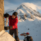 someone using an adhesive near a snowy mountain