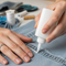 someone using fabric glue