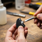 someone gluing a piece of rubber