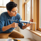 a person using a sealant
