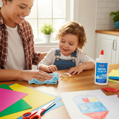 A bottle of glue with a 'Water Clean Up' label is visible on the table