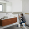 Someone tiling a bathroom