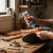 A person carefully mending a brown leather shoe with a tube of Glues Australia's rubber-based glue in a bright, organized home workshop