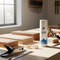 A sunlit lifestyle image for Glues Australia showing an aerosol can on a minimalist workshop workbench with woodworking tools and wood scraps