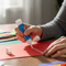 photo of a hand using a Glue Stick from 'Glues Australia' on a craft project